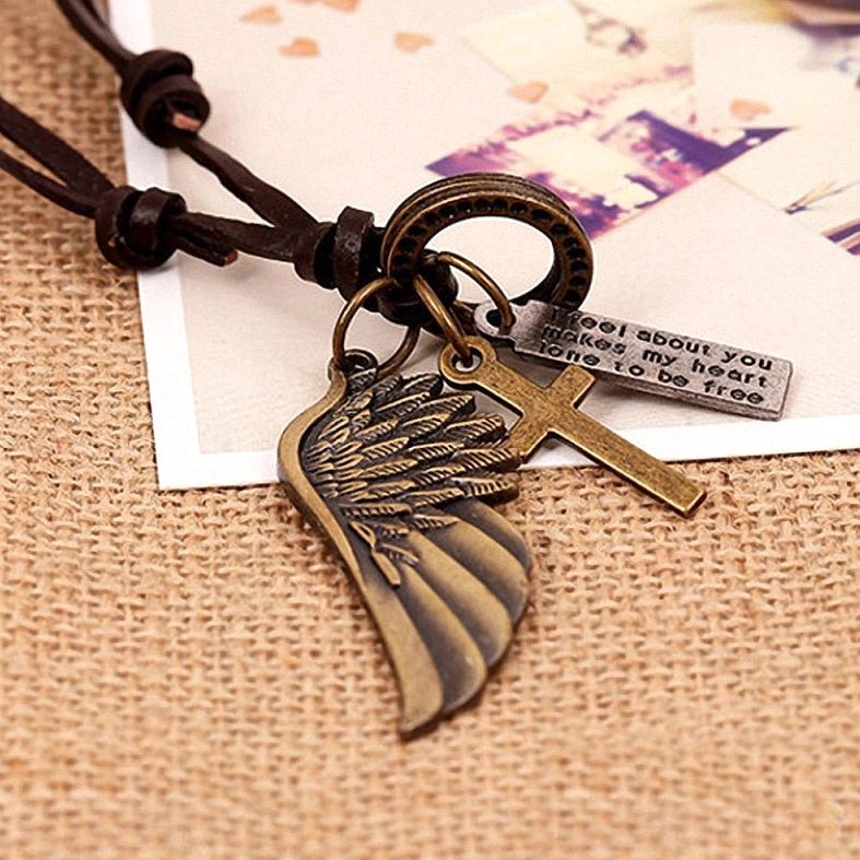 Gothic alternative angel wing necklace showing adjustable leather cord knotted closure and metal wing pendant craftsmanship detail