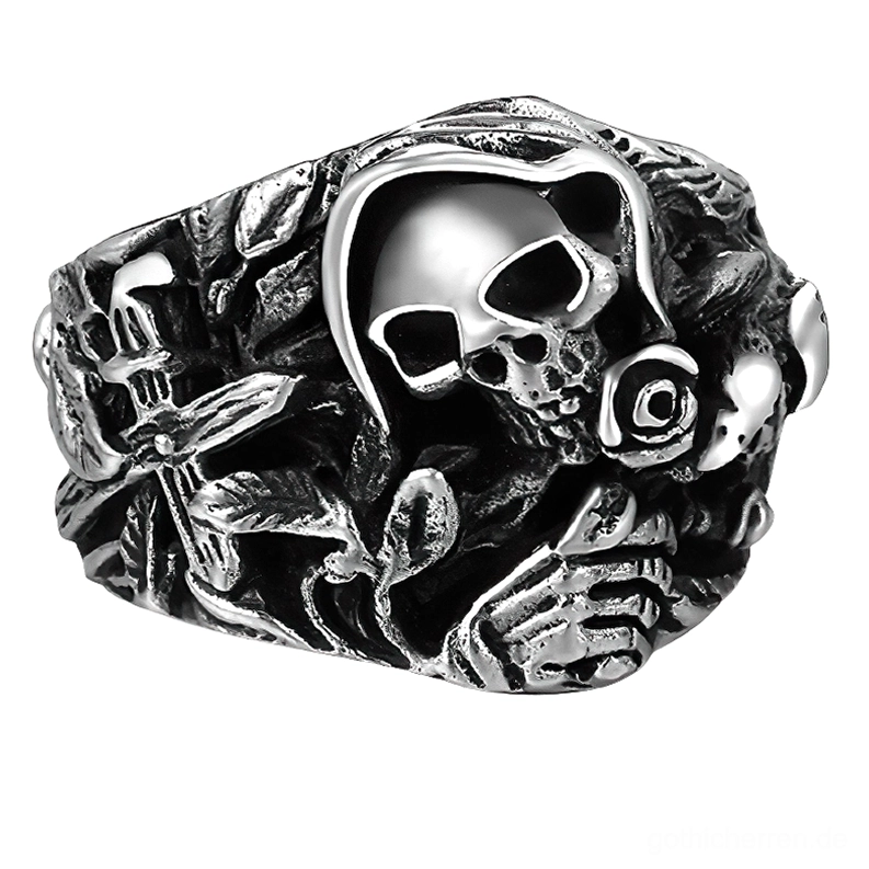 925er Sterlingsilber gotischer Totenkopf Ring mit geschnitzten Blüten- und Kreuzdetails, antikierte Silberoberfläche, Vorderansicht auf weißem Hintergrund, Memento-Mori-Design