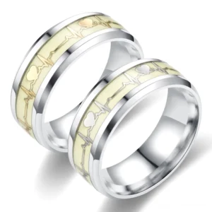 Polierter Edelstahl ECG-Herzschlag Paorringe mit lumineszierend cremeweiß Inlay, gotisches Paar-Ring-Design Draufsicht