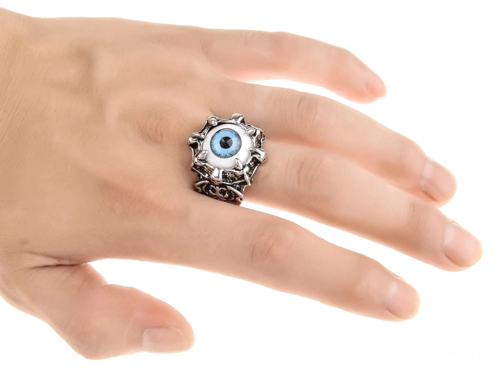 Böser-Blick-gotischer Ring mit jaggy Spike-Rahmen, blaues Kunstharz-Auge, alternative Mode-Schmuck-Statement, patinierte silberfarbene Metallarbeiten, intensives Design