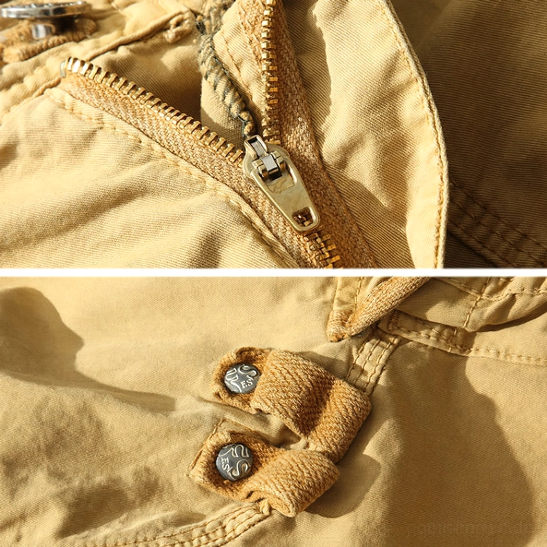Taschenlappen-Design und funktionale Details von Herren-Cargo-Shorts mit Knopfverschlüssen, strukturierten Flaps und Utility-Pocket-Engineering für praktische gotische Wear-Anwendungen