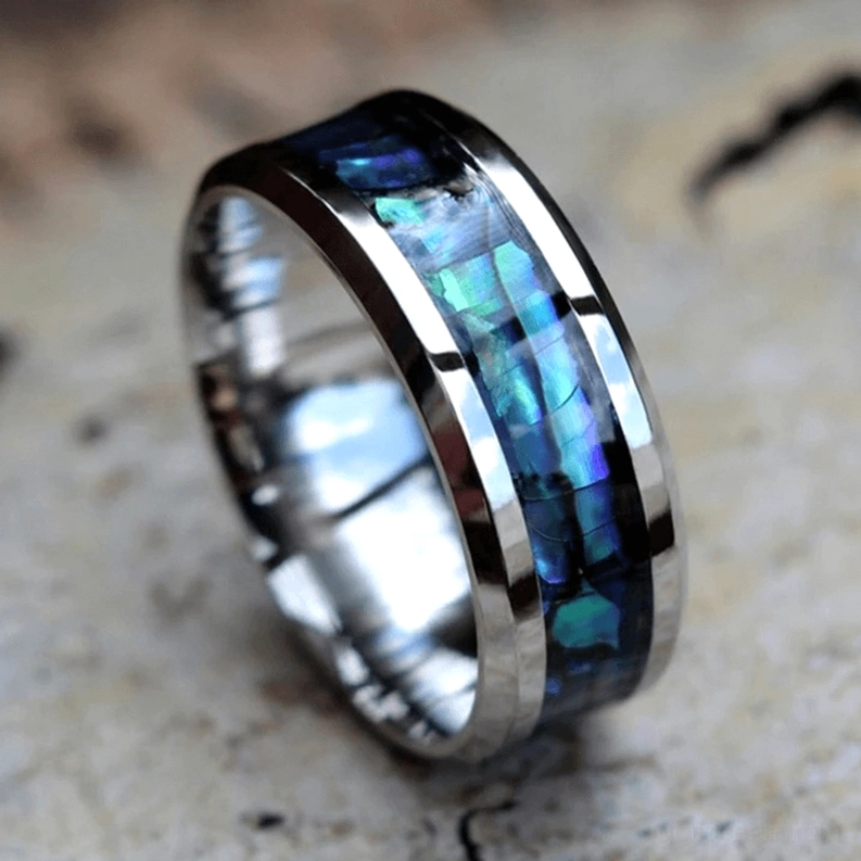 Perlmutt-Intarsia Ring Draufsicht mit dualem Metallrahmen Design das die irisierend blaugrüne Muschelschale präsentiert