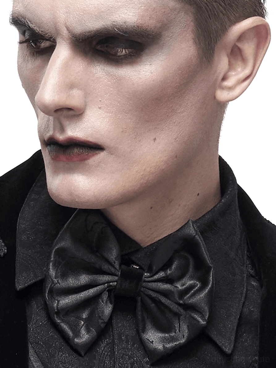 Seitenprofilansicht von gotischer Jacquard Krawatte auf Model mit formaler schwarzer Kleidung, Seitenporträt mit schwerer gotischer Makeup-Stilisierung und Gothic-Ästhetik