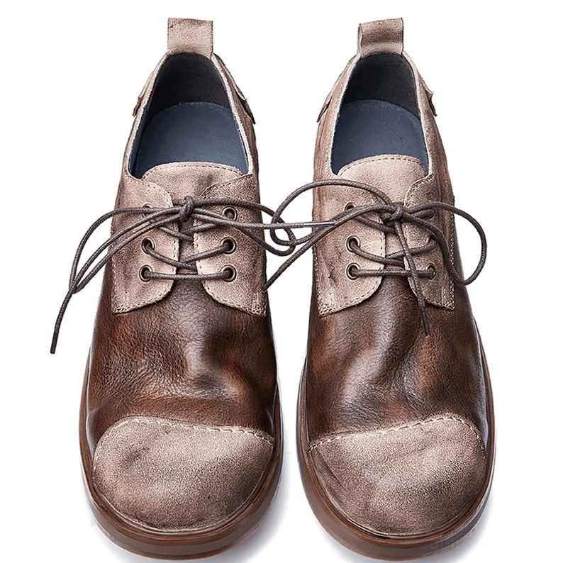 Men's dark distressed leather gothic lace-up boots flat lay top-down view, displaying blue inner lining, lace-up closure detail, padded insole and weathered leather texture