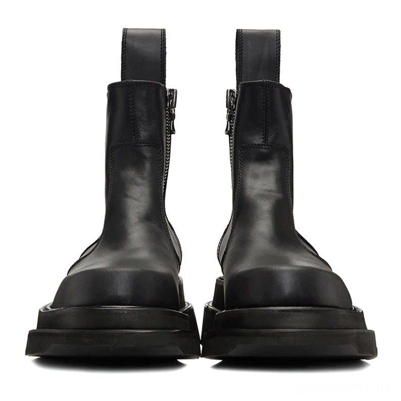 Paar schwarzer Echtleder-Chelsea-Stiefel mit Plateau-Sohle in direkter Vorderansicht, zeigt beide seitlichen Reißverschlüsse, flache dicke Plattformsohle und symmetrisches Design, Dark Fashion