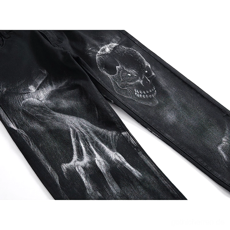 Schwarze Denim-Jeans Totenkopf-Geisterhand-Druck verblasstes Textur-Nahausschnitt Flachlage künstlerisches Design