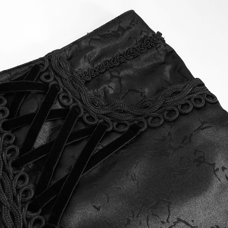Schwarze Gothic-Cargohose Schnür-Taille Nahansicht – ornamentale samtiger Flechtdetail und gotischer Schnürverschluss-Mechanismus