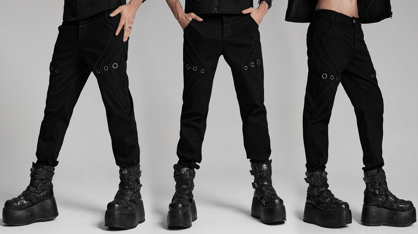 Dreidimensionale Patchwork-Konstruktion der schwarzen Gothic-Denim-Hose aus Winkelansicht, zeigt mehrschichtige Stoff-Aufbau und architektonisches Design