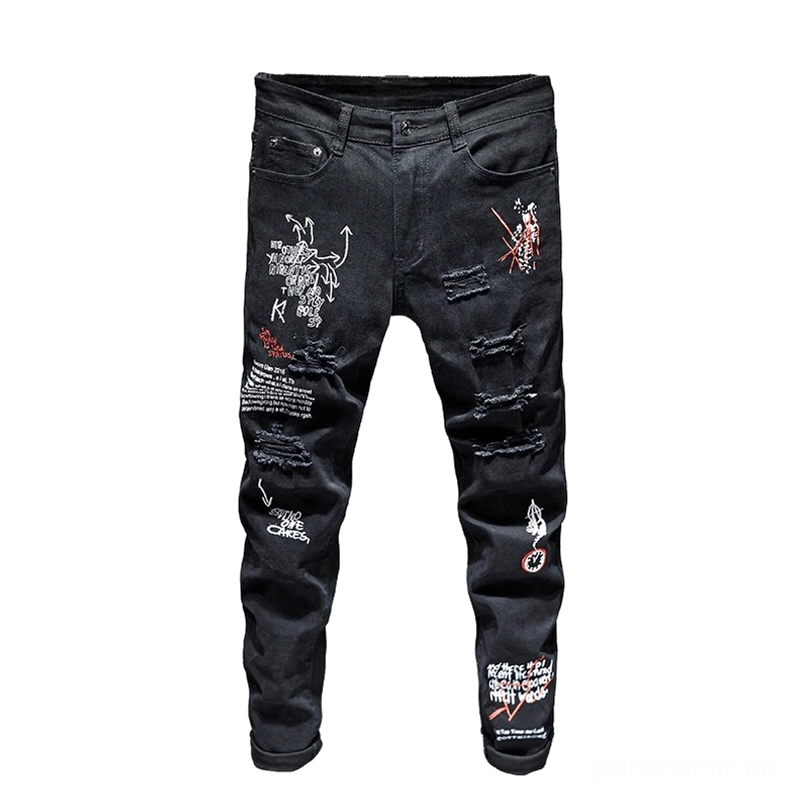 Schwarze Gothic-Graffiti-Denim-Jeans Flat-Lay Ansicht, zeigt mehrfache zerrissene Löcher und vollständige Abdeckung mit gothic Grafik- und Buchstaben-Drucken und zerstörten Details