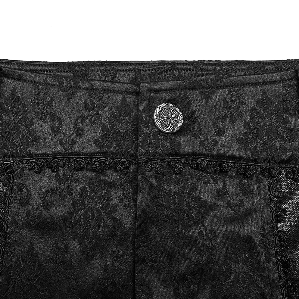 Schwarze Gothic-Röhrenhose mit Jacquard-Damast und Spitzenborten Bund-Nahaufnahme zeigt verzierter Metallknopf und hochwertige Verarbeitung