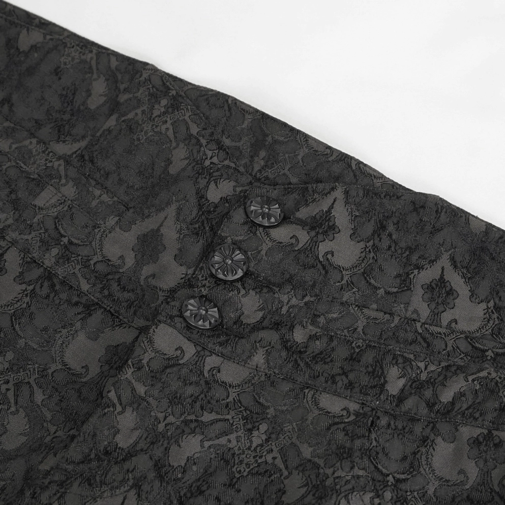 Nahaufnahme-Detail schwarzer Damast-Jacquard-Stoff der Gothic Röhrenhose mit aufwendigen barocken Mustern, Premium-Marken-Zierknoepfe auf der Taille, feine Webstruktur und Verarbeitung