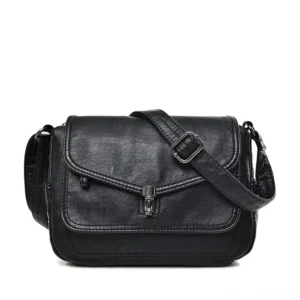 Schwarze Gothic Vintage Umhängetasche aus weichem Leder mit Push-Lock Drehverschluss, Frontansicht auf weißem Hintergrund, Dark Academia Schultertasche