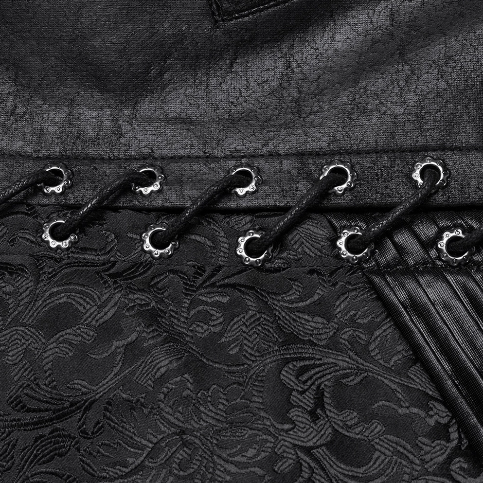 Schwarze gotische Jacquard-Weste mit Schnür-Ösen und floralem Muster-Textur – Seitendetailansicht Nahaufnahme auf dunklem Hintergrund