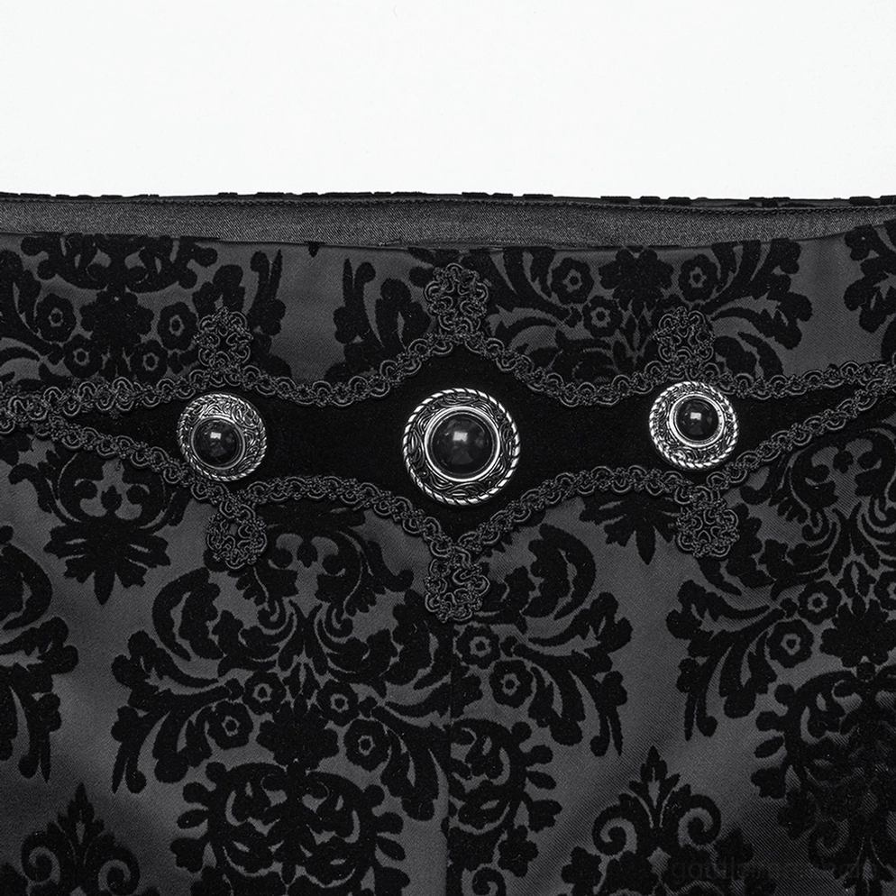 Detailaufnahme schwarze Samt-Gothic-Anzughose Taillenband zeigt Edelstein-besetzte Metallknöpfe, Samtborten und damask-Druckmuster