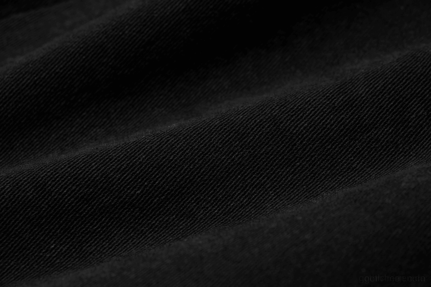 Nahaufnahme dichte schwarze gewebte Twill-Stofftextur zeigend Premium-Materialqualität, mattes Finish und Haltbarkeit der Cargohose