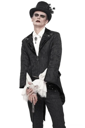 Schwarzer Samt-Gothic-Swallowtail-Frackmantel Frontansicht auf männlichem Model mit Zylinder, Jacquard-Muster und ausgestellten Manschetten, Studio-Fotografie