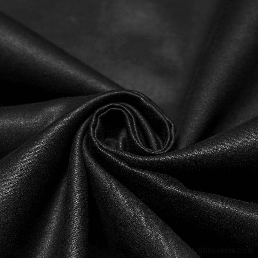 Nahaufnahme der Matt-Wildleder-Kunstledertextur - drappiertes schwarzes Kunstledermaterial mit weicher drapierbarer Oberfläche