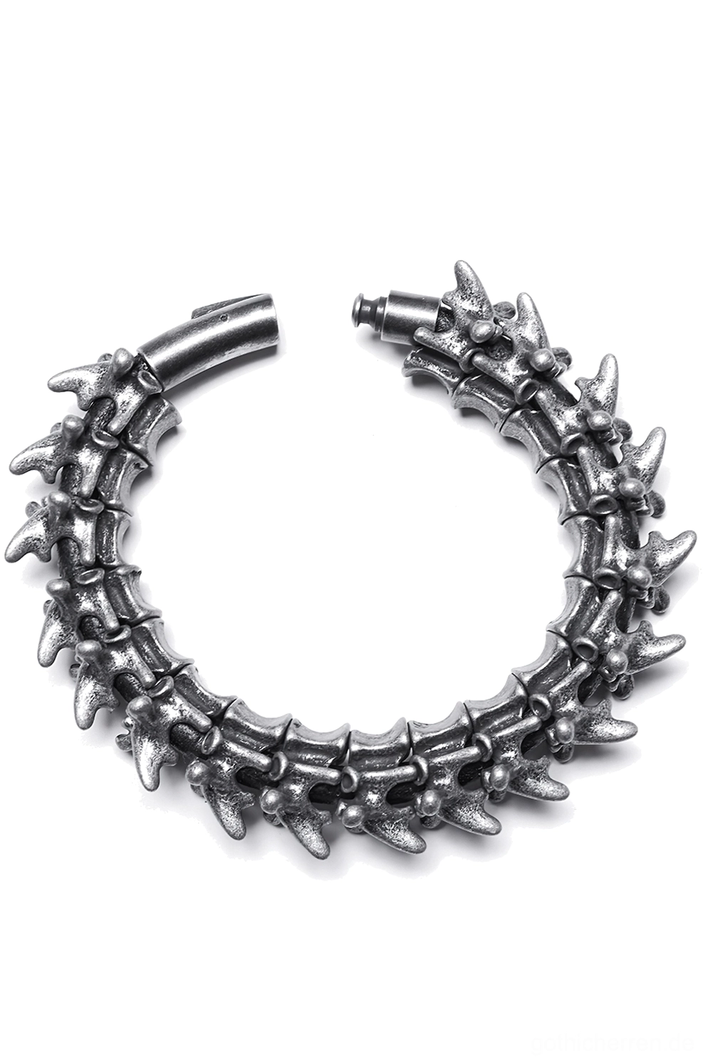 Vertebra Spike Metall-Armmanschette von oben – dunkles Silber mit geöffnetem Verschluss und segmentierter Wirbelsäulenstruktur