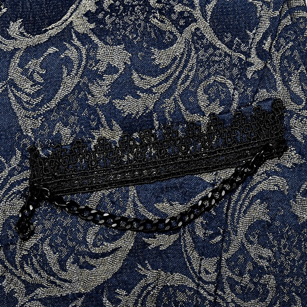 Weste Taschendetail mit schwarzer Spitzentrimm und Metallkettendekorationen auf Damast-Hintergrund